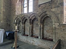 C13 stone piscina and sedilia , in the church of St. Peter and Paul, Deddington, Oxfordshire, England.