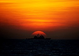 US Navy 100127-N-2760T-001 The Ticondera-class guided-missile cruiser USS Shiloh (CG 67) transits the South China Sea at sunset during Spring Patrol.jpg