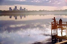 Downtown skyline in view over Bde Maka Ska and its dock