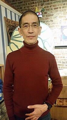 Photograph of Akito Tsuda at 2017 exhibition of Pilsen Days at La Catrina Cafe in Chicago.