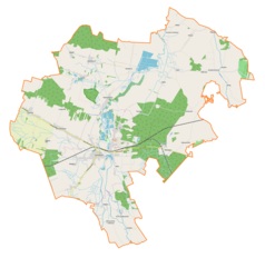 Mapa konturowa gminy Koniecpol, blisko centrum u góry znajduje się ikonka pałacu z opisem „Pałac w Radoszewnicy”