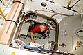 Astronaut floats in the hatchway that leads from Unity to Pressurized Mating Adapter-3 (PMA-3), which leads to Endeavour.