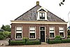 Hallenhuisboerderij met dwarsdeel in ambachtelijk-traditionele stijl