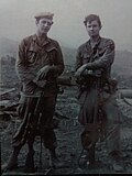 Sličica za Slika:U.S. Army snipers, March 1971, Vietnam War. Left and right views of XM-21 sniper rifles mounted with off the shelf civilian Redfield 3x9 power adjustable range finder daylight rifle scopes.jpg