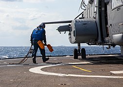 Boatswain's Mate 2nd Class Secures canadian CH-148 During Keen Sword 21.jpg