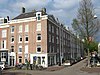 Woonblok met 103 arbeiderswoningen en twee winkels, gebouwd in opdracht van de Vereeniging ten behoeve der Arbeidersklasse te Amsterdam