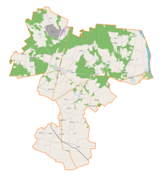 Mapa konturowa gminy Ożarów, w centrum znajduje się punkt z opisem „Tominy”