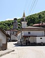 17th century-old clock tower and new mosque