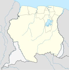 Mapa konturowa Surinamu, u góry nieco na prawo znajduje się punkt z opisem „Paramaribo”