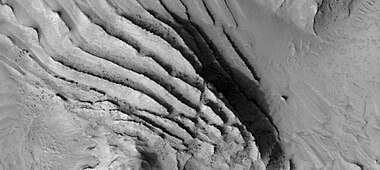 Faults in layers, as seen by HiRise under HiWish program Image is about 1 km across.