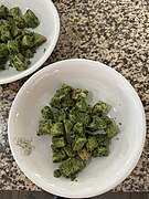 Bread is coated in cilantro-garlic paste and portioned into individual bowls