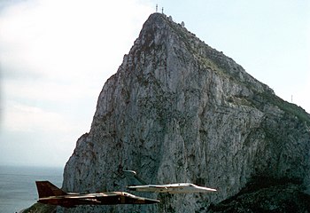 A U.S. F-111F and an EF-111A near the Rock of Gibraltar.