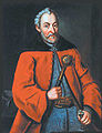 El Hetman Jan Zamoyski vestido con una delia carmesí y un żupan azul de seda. En su mano derecha lleva una bulawa de hetman.