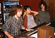 Mitch Easter sitting at a mixing board next to two members of Dreams So Real