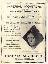 Sebuah iklan untuk Alam Ara di Majestic Cinema, c. 1931. Iklan tersebut menampilkan pemeran utama perempuan Zubeida pada bagian kanan tengah, dengan sekelilingnya diisi dengan judul film, kalimat promosional, kredit pemeran dan sutradara, dan tempat pemutaran pertama dari film tersebut.