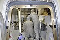 SpaceX technicians stow cargo in the COTS 2 Dragon at LC-40 on 4 April 2012.