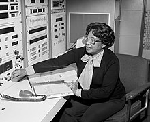 Mary Jackson sitting, adjusting a control on an instrument