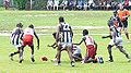 Players contest the loose ball in the Tiwi Islands Grand Final