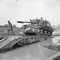 Achilles 17pdr tank destroyer crossing the River Savio on a Churchill ARK which was driven into the river, 24 October 1944