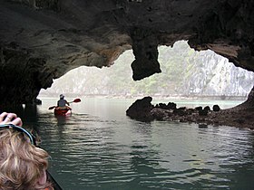 Kayaking through a cave in Cat Ba Island