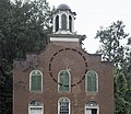 Instead of repairing this bullet hole to look like a new wall, they restored it by embedding a replica cannonball