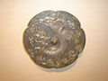 A Tang Dynasty bronze mirror with dragon