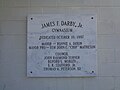 Marble dedication plaque on James F. Darby Jr. Gymnasium