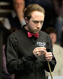 Michael Wasley holding his cue