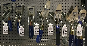 Various trowels of different sizes and shapes in hardware store in Germany (cropped V3).jpg