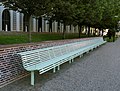 A long wooden bench in central Ystad.
