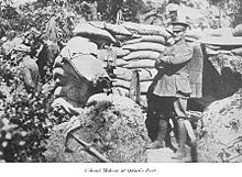 a man in uniform standing in front of a tent