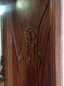 Carved wood panel in the vestibule