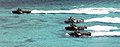 Four Italian Amphibious Assault Vehicles approch a beach in Sardegna.