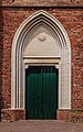 Martinikerk in Groningen. Zij ingang met gedenkplaat.