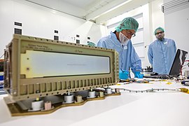 Worker checks laptop for CubeSat software issues in the SSPF.jpg