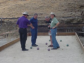 Bocce players tallying the score of a match