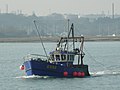 A fishing boat fishing for shellfish near the Calshot Spit