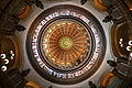 Image 47The dome of the Illinois State Capitol. Designed by architects Cochrane and Garnsey, the dome's interior features a plaster frieze painted to resemble bronze and illustrating scenes from Illinois history. Stained glass windows, including a stained glass replica of the State Seal, appear in the oculus. Ground was first broken for the new capitol on March 11, 1869, and it was completed twenty years later. Photo credit: Daniel Schwen (from Portal:Illinois/Selected picture)