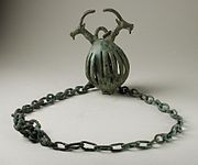 Western Iran, circa 1000-650 B.C. Cast bronze bell, 5 1/2 x2 inches. Hung on herd animal?