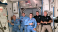 Da Sx Anatoli Ivanishin, Ivan Vagner e Christopher Cassidy danno il benvenuto a Robert Behnken e Douglas Hurley alla Stazione spaziale internazionale.