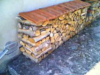 Stacked with crib end, in eastern France, covered by terracotta tiles.