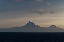 Isanotski (8,104 ft; 2,470 m) and Roundtop (6,128 ft; 1,868 m) volcanoes as seen from the Unimak Pass in the morning light.