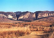 Pastel striated stone outcroppings jut from the plains