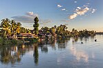 Thumbnail for File:Mekong bank with stilt dwellings and clouds at golden hour in Don Det Laos.jpg