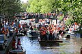 2007 - Dancing people dressed in orange on the canals of Amsterdam during Queen's Day