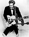 Image 11The 1950s were the true birth of the rock and roll music genre, led by figures such as Chuck Berry (pictured), Elvis Presley, Buddy Holly, Jerry Lee Lewis and others. (from 1950s)