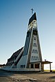 * Nomination Hammerfest church, by User:Ludo29 -- Rama 08:28, 19 July 2010 (UTC) * Decline  Comment Find it a good idea to take the church from the shadow side but with the enlightend tower. Could you correct the spot (sensor dust?) in the upper left part of the sky? --Haneburger 12:54, 24 July 2010 (UTC) Is it tilted? Seems to me. Pitke 15:26, 29 July 2010 (UTC)  Comment It is not tilted, but there is a perspective effect that makes the columns at the entrance and the electric lights on the left lean slightly inward. Would support if this were corrected. --Johannes Robalotoff 21:33, 2 August 2010 (UTC)  Oppose It's an appealing picture, but has "triangle" distortion. Pitke 07:14, 7 August 2010 (UTC)