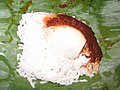 Nasi lemak yang biasa terdapat di warung tepi jalan, berlauk sambal ikan bilis Malaysia.