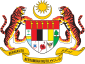 Shield showing the symbols of the Malaysian states with a star and crescent above and a motto below, supported by two tigers