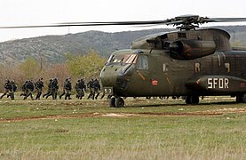 German CH-53 Helicopter assigned to the Stabilization Force and Portuguese Army Soldiers.jpg